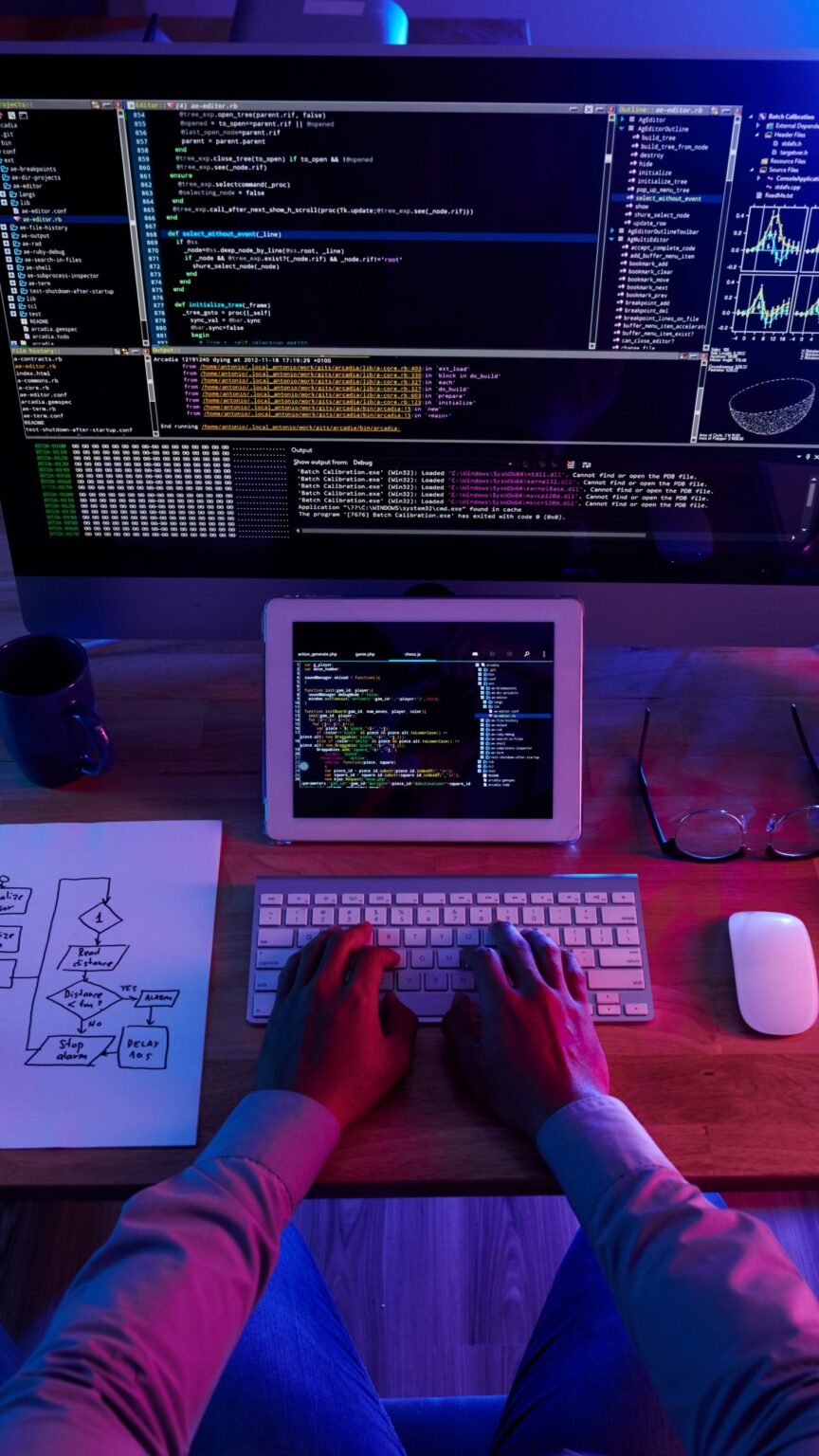 top-view-unrecognizable-hacker-performing-cyberattack-night